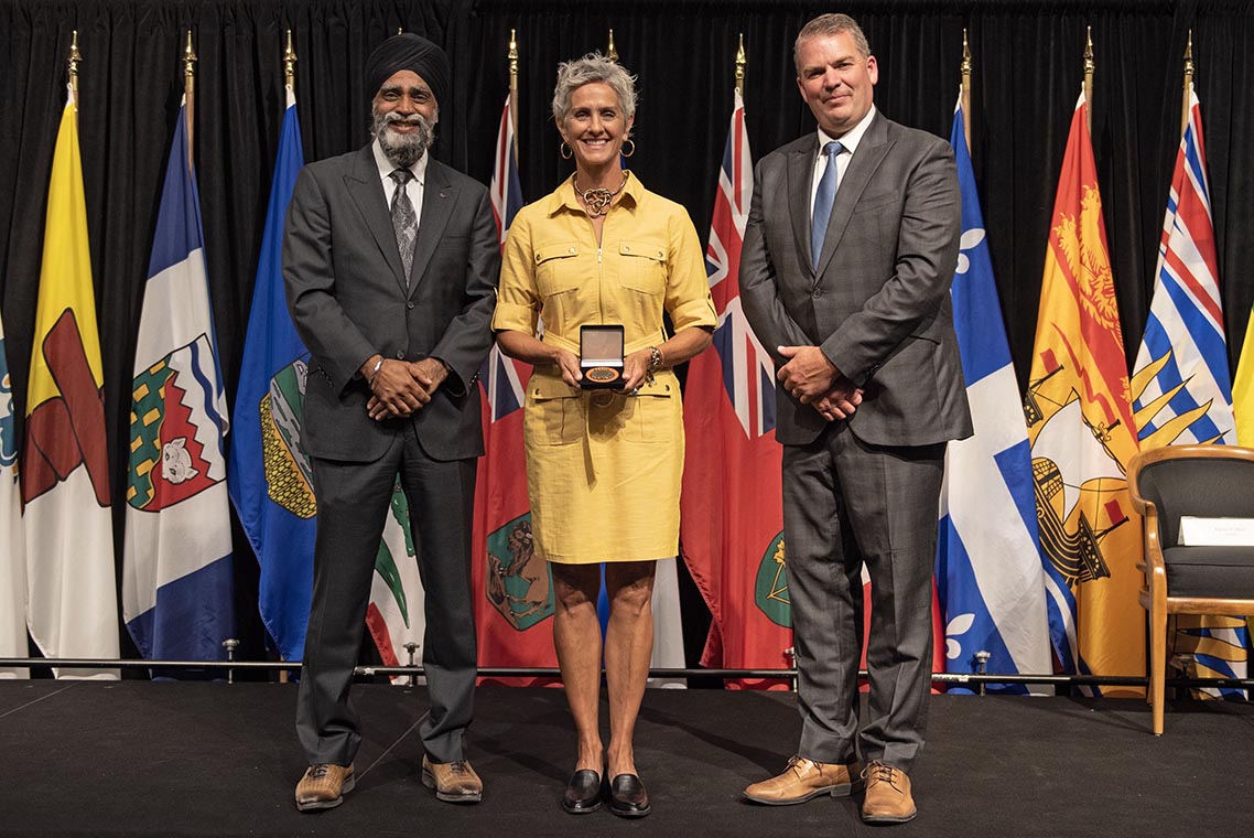 The Honourable Harjit S. Sajjan, President of the King’s Privy Council for Canada and Minister of  Emergency Preparedness (far left) and Minister responsible for the Pacific  Economic Development Agency of Canada, and the Honourable Bloyce Thompson, Deputy  Premier, Minister of Justice and Public Safety and Attorney General for Prince  Edward Island (far right) are pictured with the 2022 award recipient of the  Emergency Management Exemplary Service Award for the Search and Rescue  category.