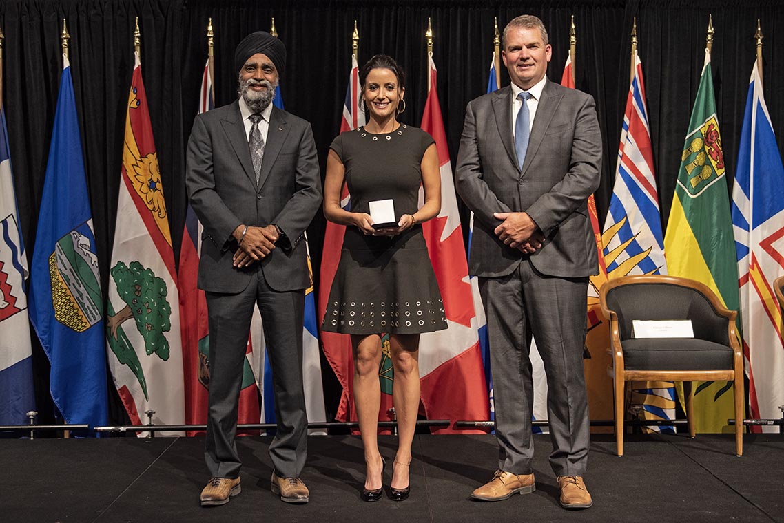 The Honourable Harjit S. Sajjan, President of the King’s Privy Council for Canada and Minister of  Emergency Preparedness (far left) and Minister responsible for the Pacific  Economic Development Agency of Canada, and the Honourable Bloyce Thompson, Deputy  Premier, Minister of Justice and Public Safety and Attorney General for Prince  Edward Island (far right) are pictured with the 2022 award recipient of the  Emergency Management Exemplary Service Award for the Outstanding Contribution  to Emergency Management category.