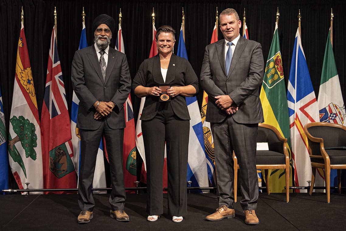 The Honourable Harjit S. Sajjan, President of the King’s Privy Council for Canada and Minister of  Emergency Preparedness (far left) and Minister responsible for the Pacific Economic  Development Agency of Canada, and the Honourable Bloyce Thompson, Deputy  Premier, Minister of Justice and Public Safety and Attorney General for Prince  Edward Island (far right) are pictured with the 2022 award recipient of the  Emergency Management Exemplary Service Award for the Search and Rescue Volunteers  category.